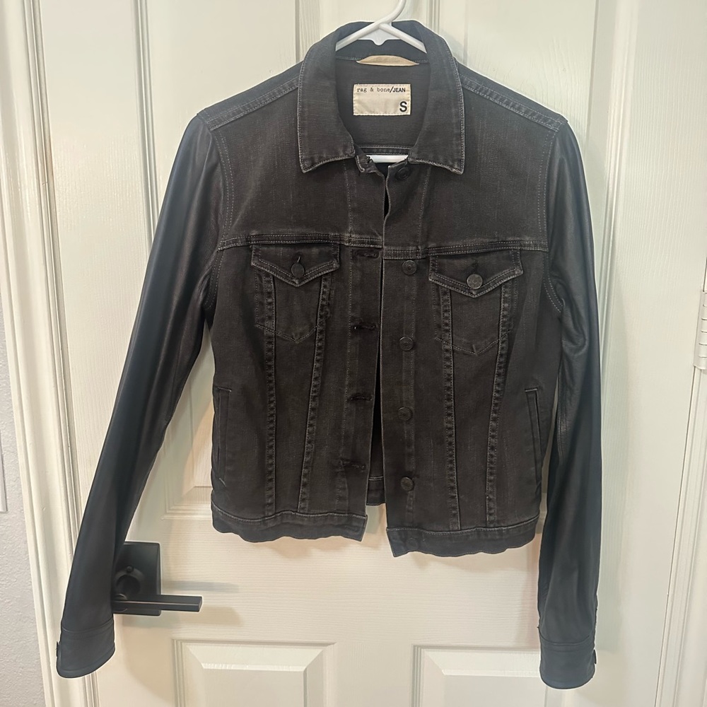 Black denim jacket with leather sleeves